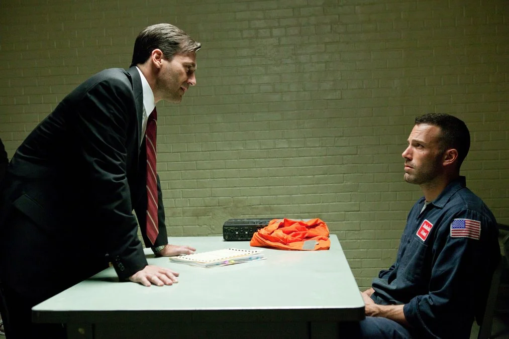 (L-r) JON HAMM as Detective Frawley and BEN AFFLECK as Doug MacRay in Warner Bros. Pictures and Legendary Pictures ...