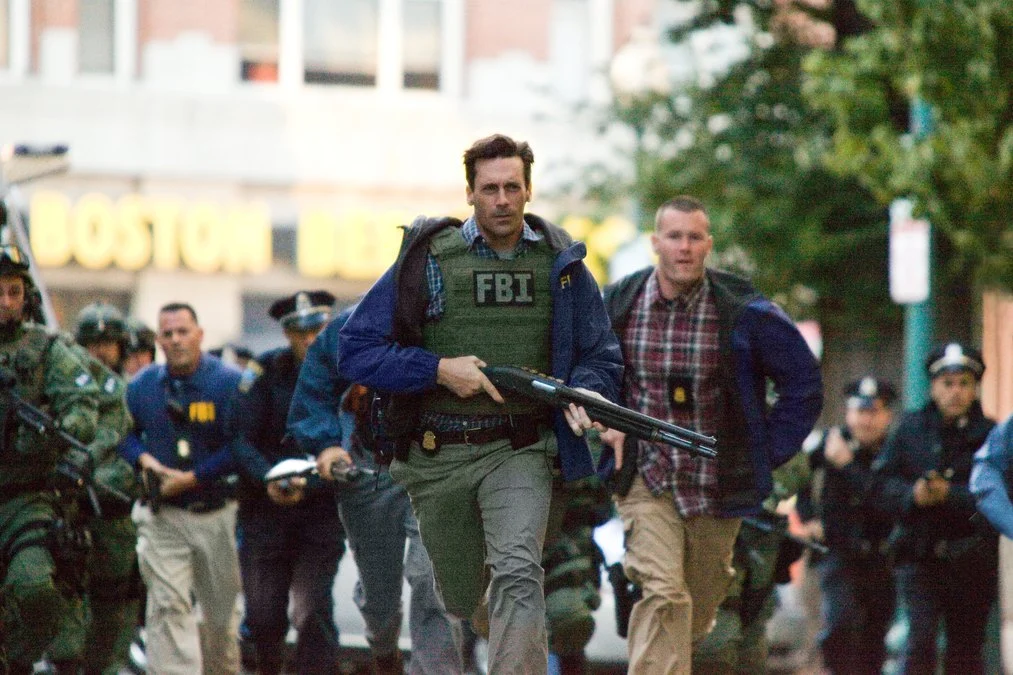 JON HAMM (center) as Detective Frawley in Warner Bros. Pictures and Legendary Pictures crime drama The Town, dist...